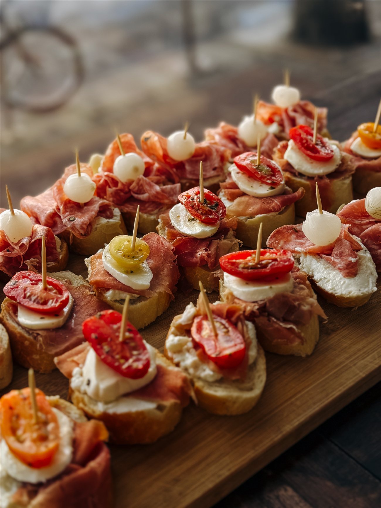Caprese canapés — toasted baguette with fresh mozzarella and tomato from da Cecot catering, Edmonton