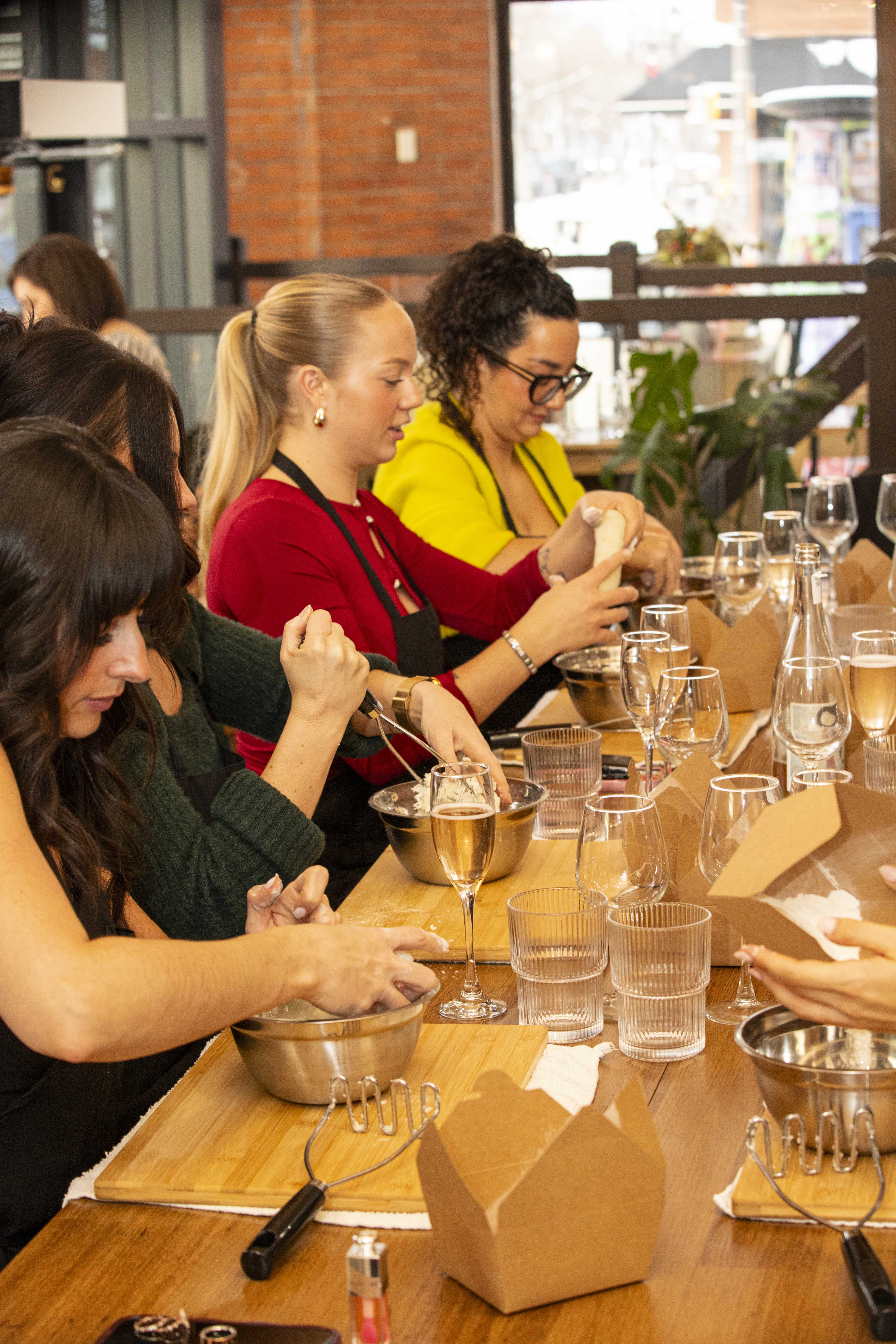 Guests at work during a hands-on pasta class at da Cecot