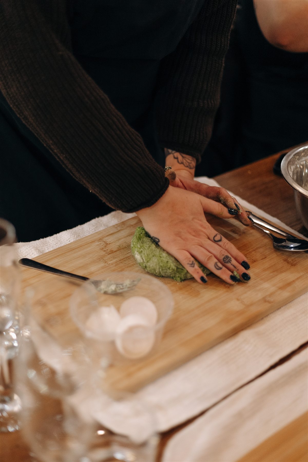 Hands kneading fresh pasta dough at da Cecot, Edmonton